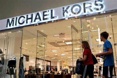 Michael Kors ups the glamour, buys Versace for  billion